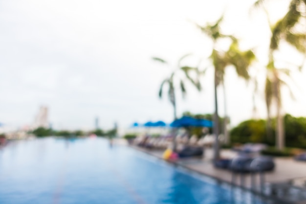 Unfocused swimming pool with palm trees