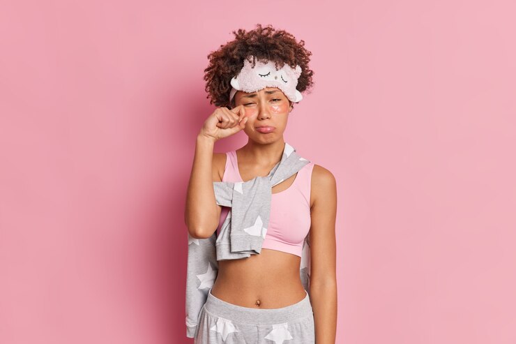 Free Photo unhappy african american woman rubs eyes has sleepy expression wipes tears applies collagen patches under eyes