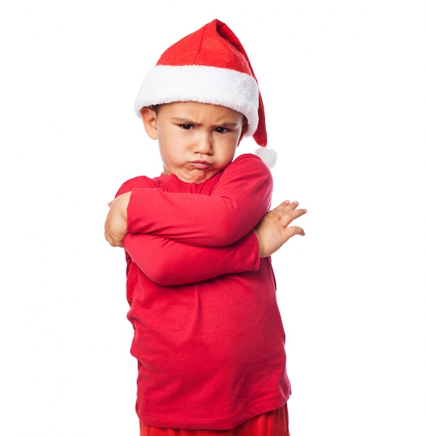 Несчастный ребенок с шляпу Санта Клауса