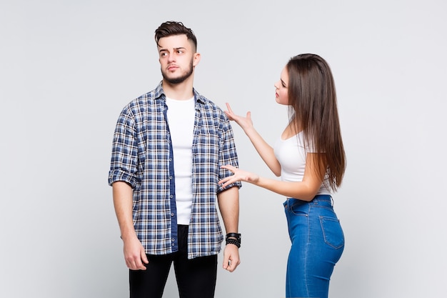 Free photo unhappy couple standing and quarrel