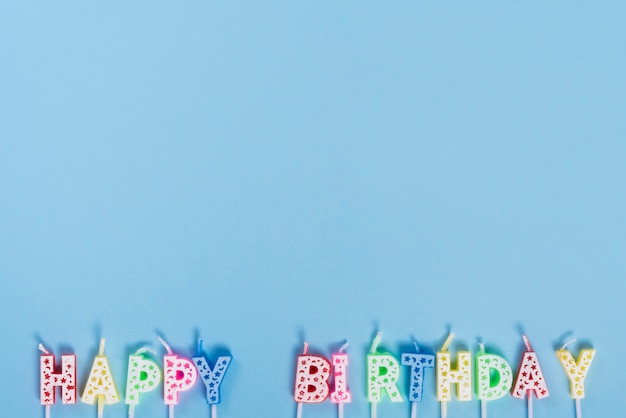 Unlit birthday candles with letters