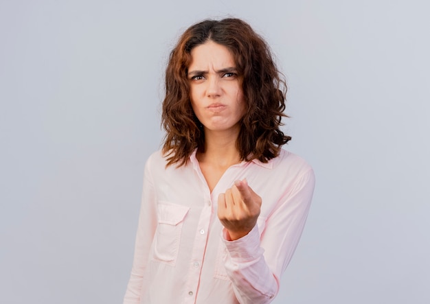 Free photo unpleased young caucasian woman points at camera