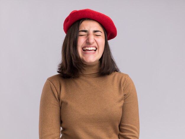 Unpleased young pretty caucasian girl with beret hat standing with closed eyes isolated on white wall with copy space