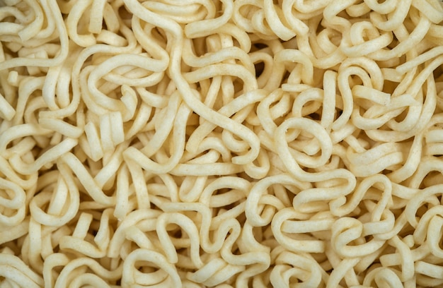 Unprepared noodles on a dark background.