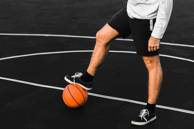 Unrecognisable athlete training on court