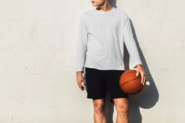 Unrecognisable basketball player looking away