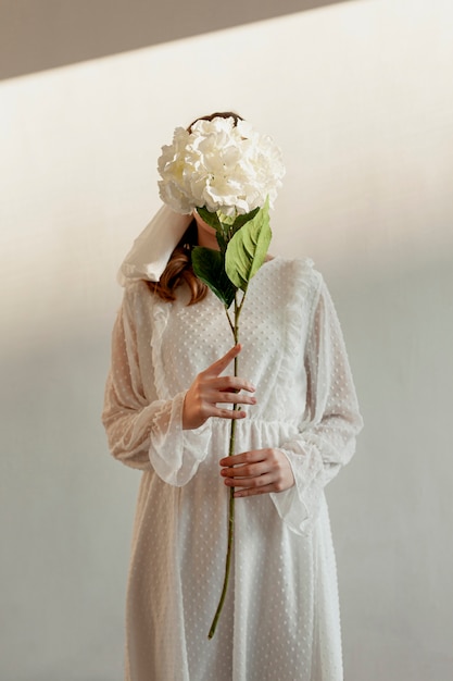 Unrecognisable woman holding flower