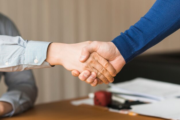 Unrecognizable businessmen handshaking