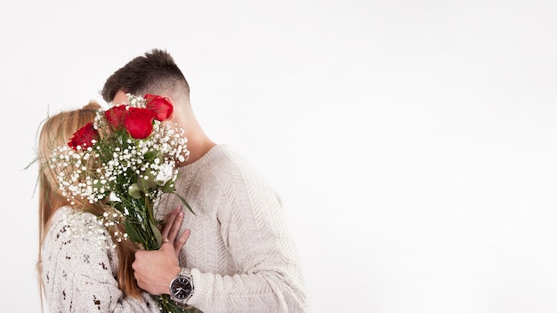 Unrecognizable couple with bouquet