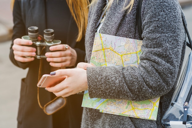 Unrecognizable female travellers