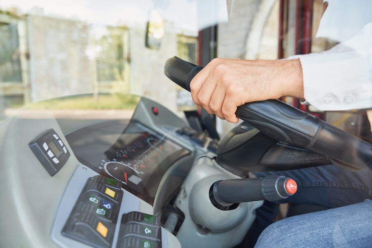Free Photo unrecognizable man wearing shirt driving intercity bus at daytime crop view of male professional bus