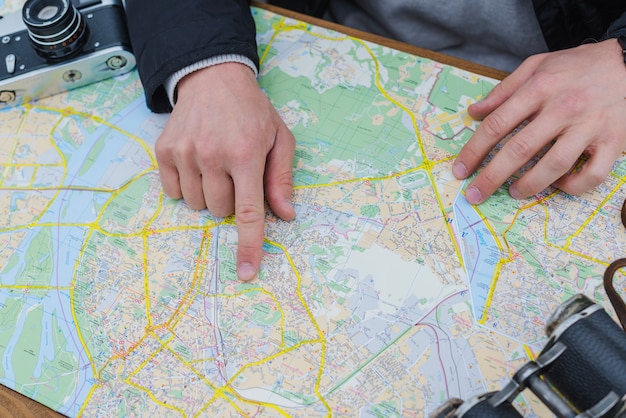 Free photo unrecognizable man with map