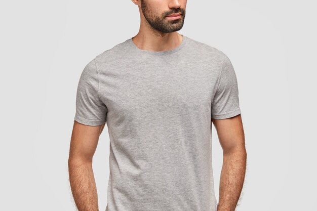 Unrecongnizable bearded man dressed in casual grey t shirt