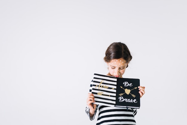 Unwell girl with notebooks