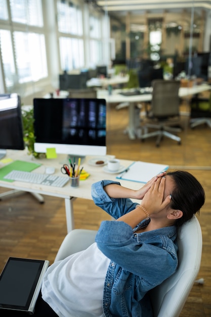 Upset female graphic designer in office