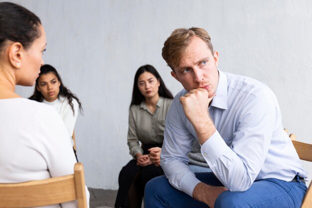 Upset man at a group therapy session