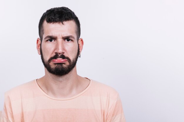 Upset man looking at camera