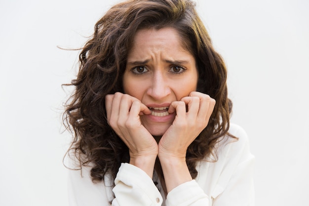 Free photo upset nervous woman biting nails