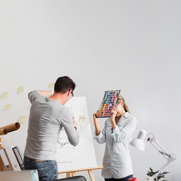 Upset woman and man working on company problems