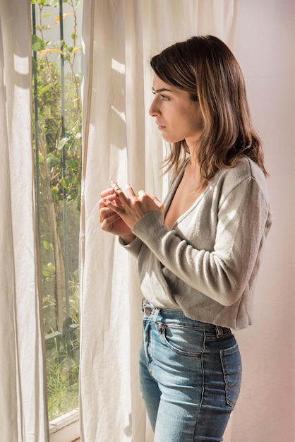 Upset woman pulling out wedding ring