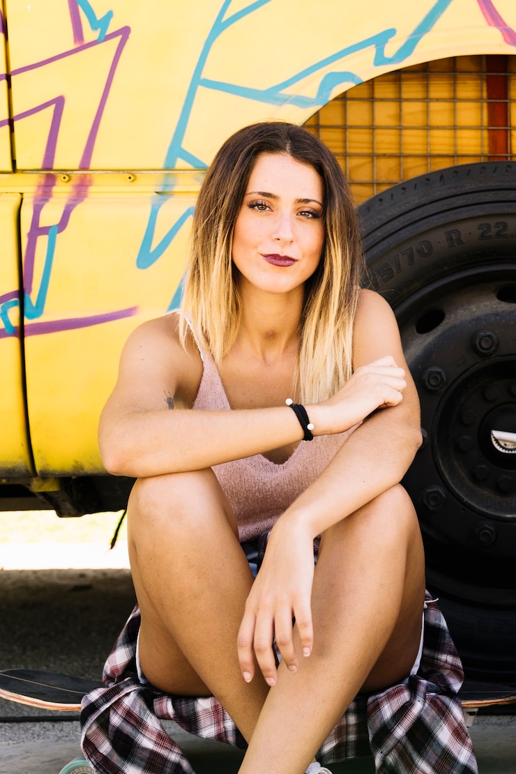 Free Photo urban girl leaning against bus