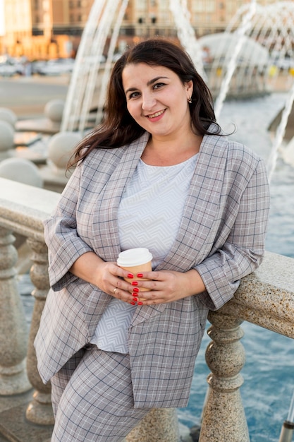 Urban portrait of brunette woman in costume