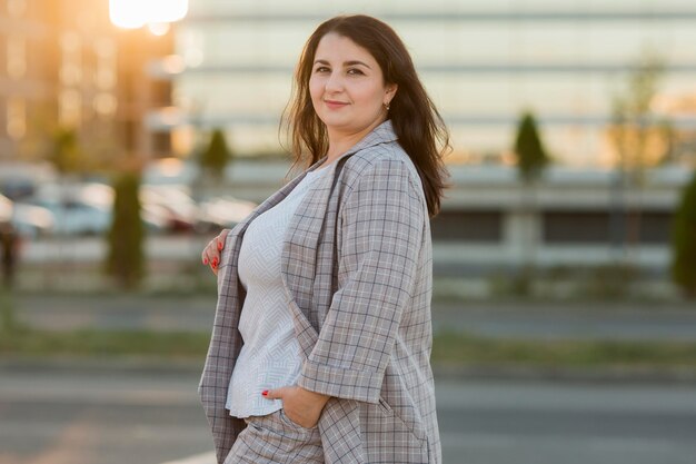 Urban portrait of smiley woman in costume