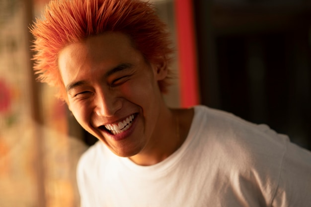 Urban portrait of young man with orange hair