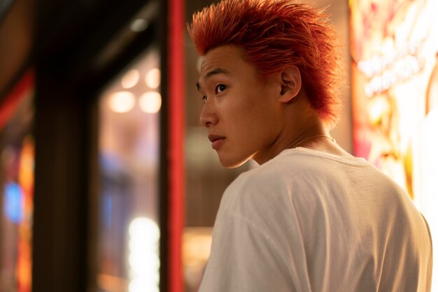 Urban portrait of young man with orange hair