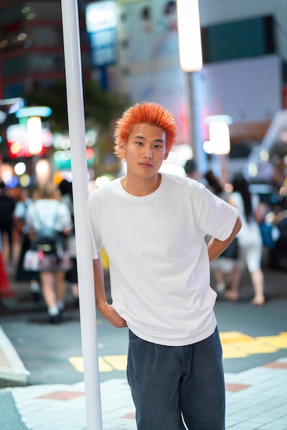 Urban portrait of young man with orange hair