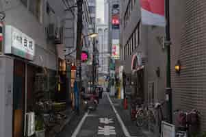 Free photo urban view with people on narrow street