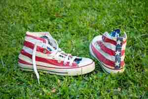Free photo usa flag sneakers on grass