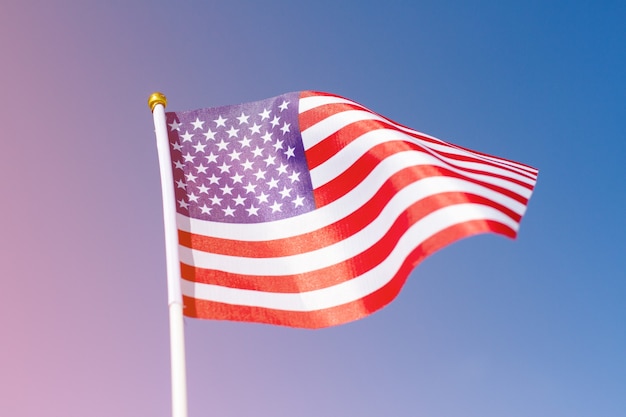 Usa flag waving in blue sky. american flag with the space for your content.