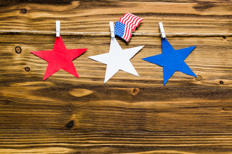 Free Photo usa independence day background with three stars on clothesline