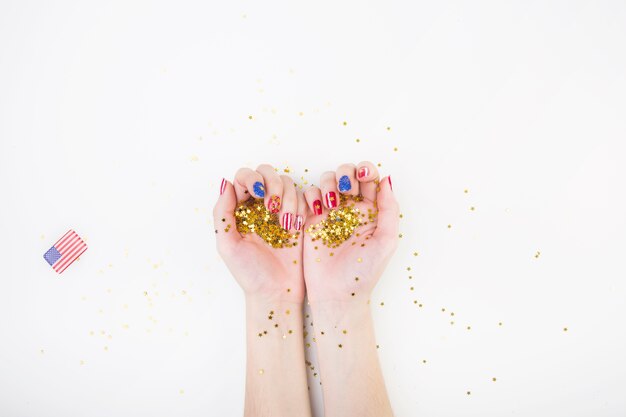 Usa independence day concept with hands holding confetti