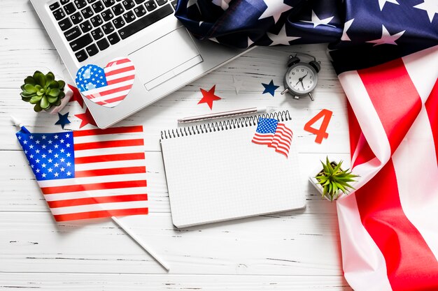 Usa independence day concept with notepad and laptop