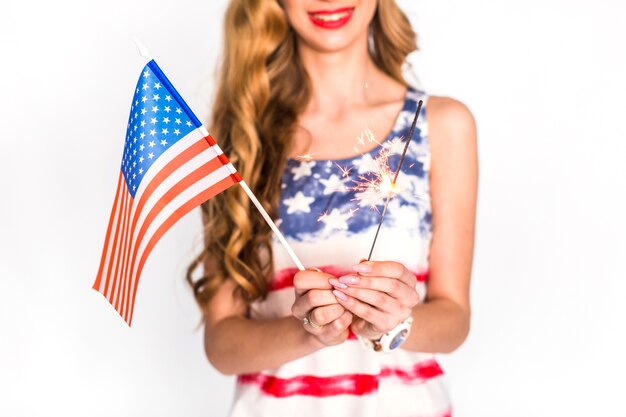 Usa independence day concept with smiling woman holding flag