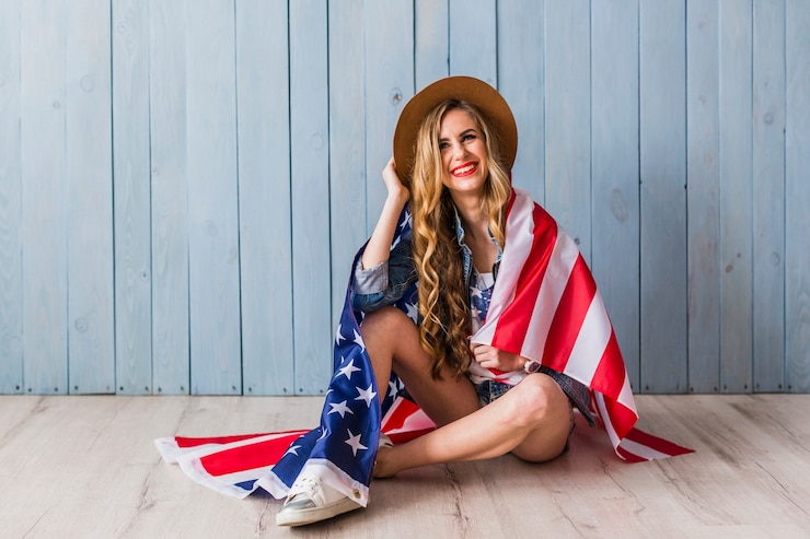 Free Photo usa independence day concept with woman covered in flag