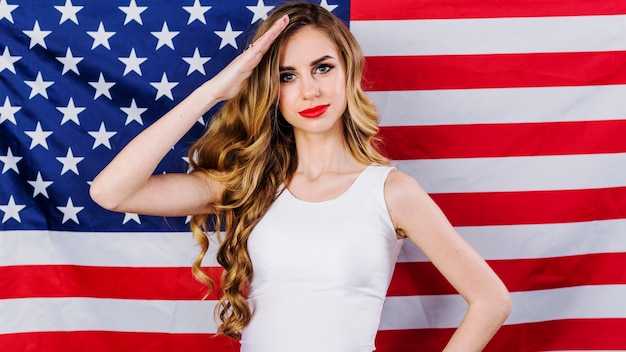 Usa independence day concept with woman saluting