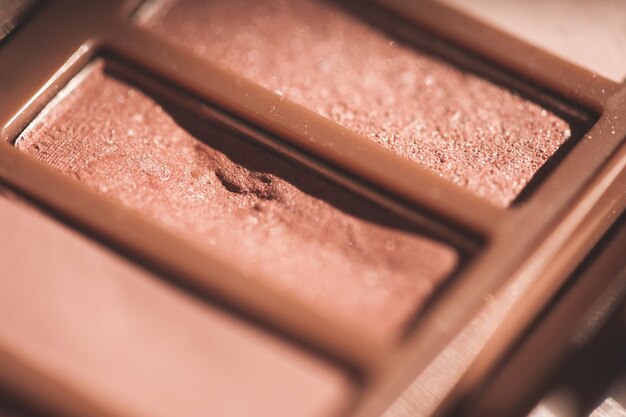 Used eyeshadows in pink glitter shade palette closeup. selective focus.