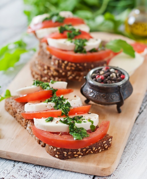 Useful dietary sandwiches with mozzarella, tomatoes and rye bread