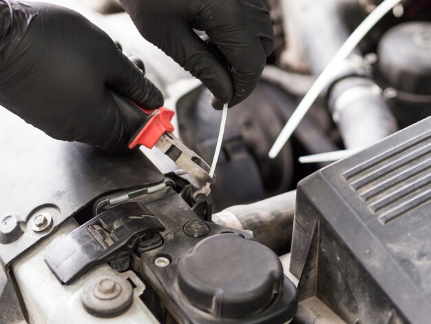 Using cutters to cut cable tie