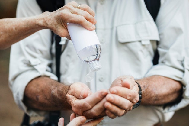 Using hand sanitizer while traveling in the new normal