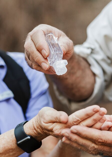 Using hand sanitizer while traveling in the new normal