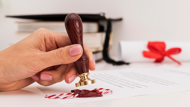 Using wax seal for graduation diploma certificate