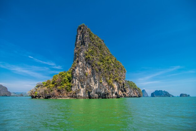 Vacation in Thailand. View at the rocks, sea, beach from the cave.