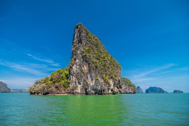 Vacation in Thailand. View at the rocks, sea, beach from the cave.