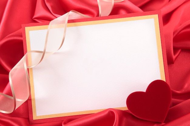 Valentine card with a ribbon and a heart