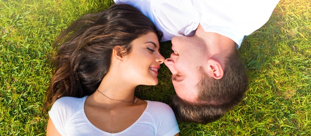 A happy young couple outdoors | Source: Freepik