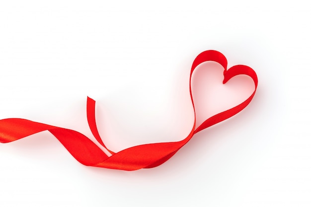 Free photo valentine heart. red silk ribbon. love symbol .